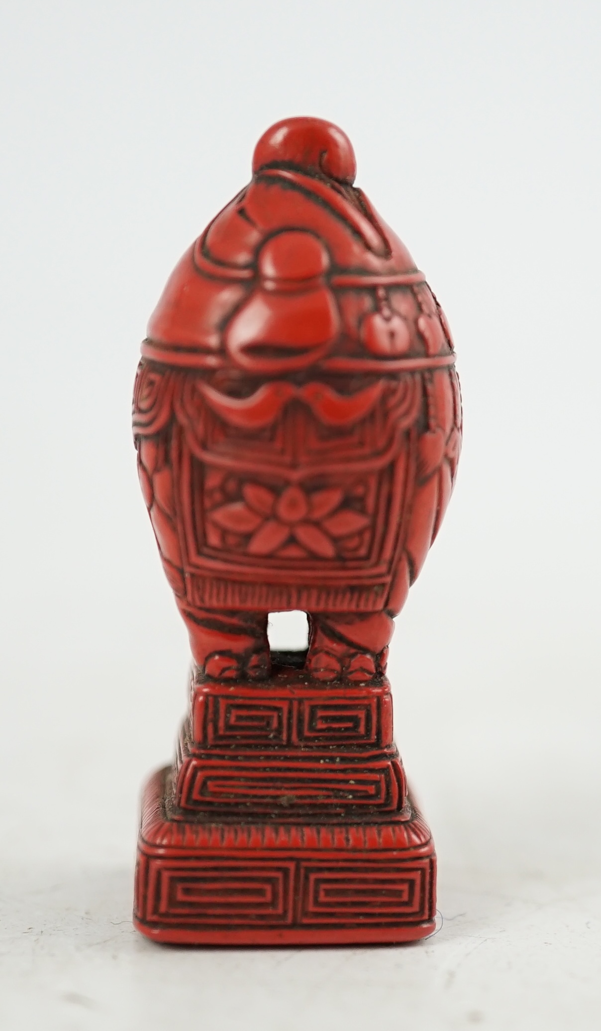 A small Japanese tsuishu (carved red lacquer) seal netsuke, 19th century